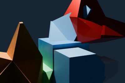 A group of different colored shapes on a black background