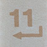 a white towel with a brown arrow drawn on it