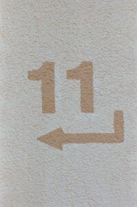 a white towel with a brown arrow drawn on it