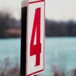 white and red number 4 signage in shallow focus photography