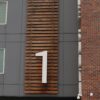 the number one sign is on the side of a building