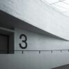 the number three on the wall of a building