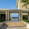 A large building with steps leading to the beach