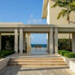 A large building with steps leading to the beach