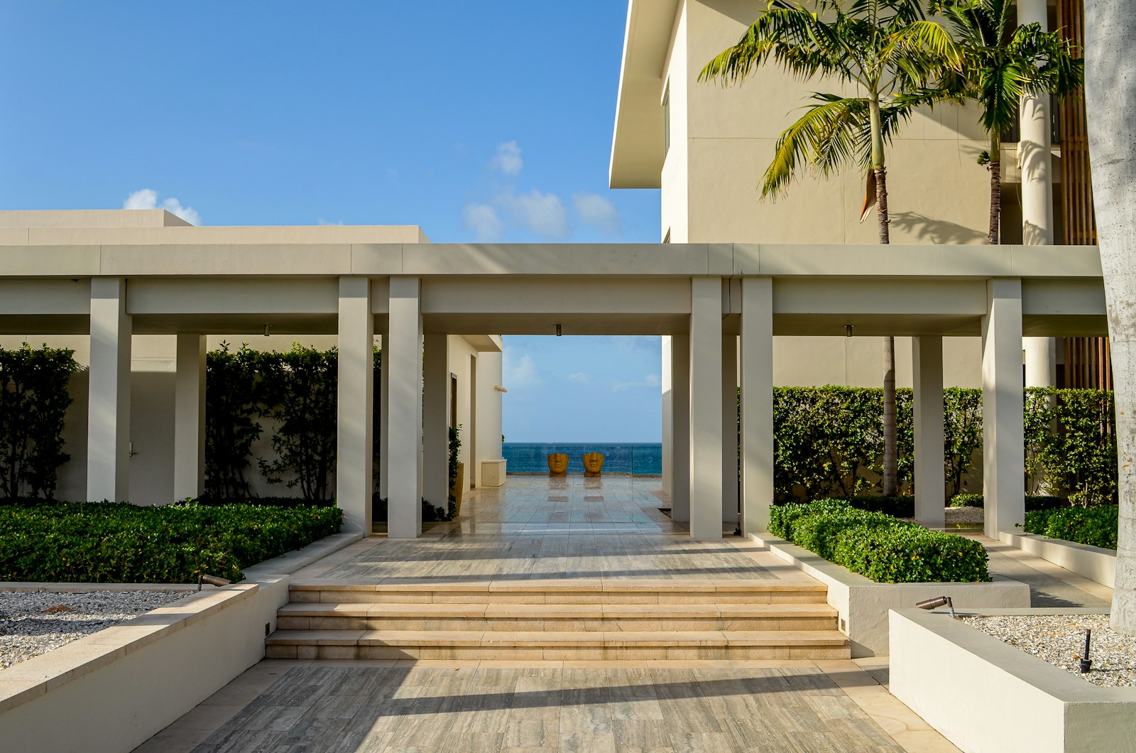 A large building with steps leading to the beach