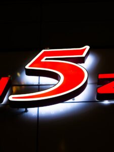 a lighted sign with the number five on it