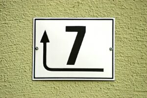 white and black arrow sign